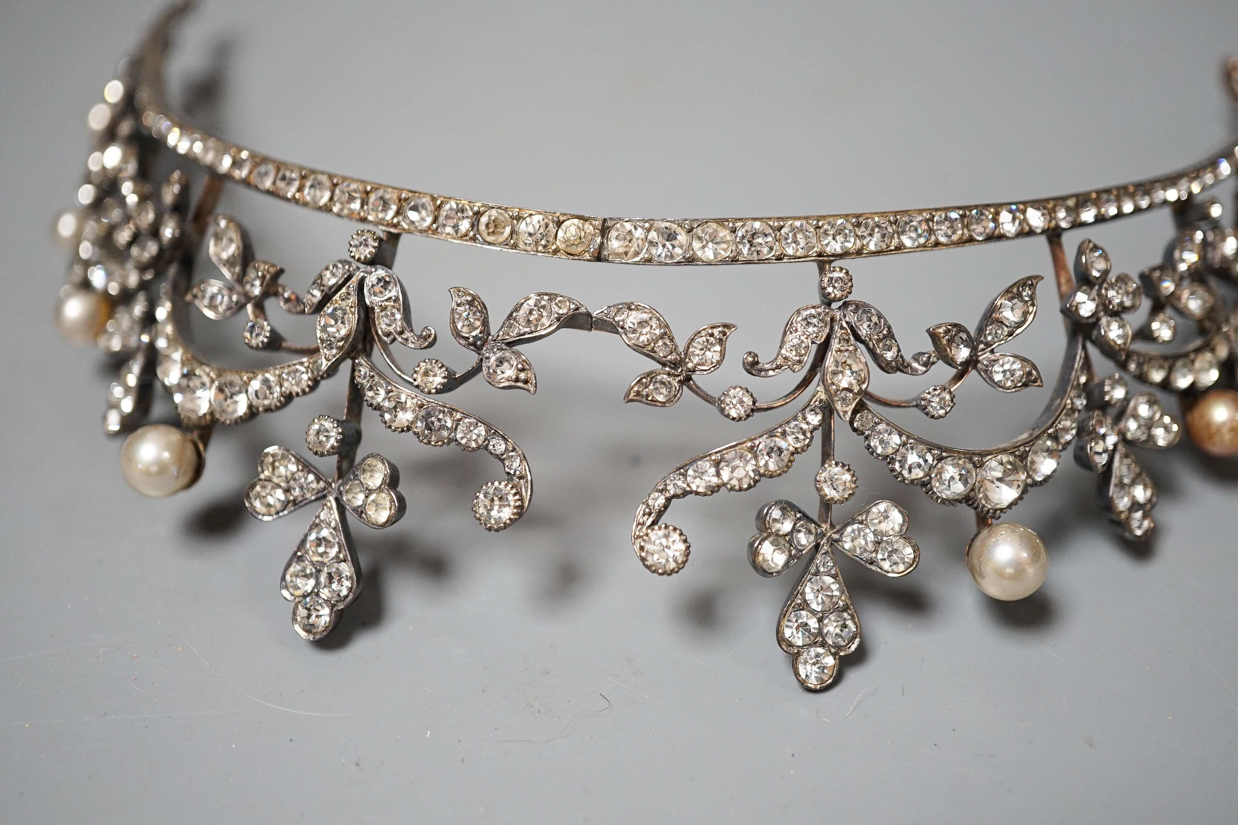 An Edwardian white metal and paste set tiara, 13cm.